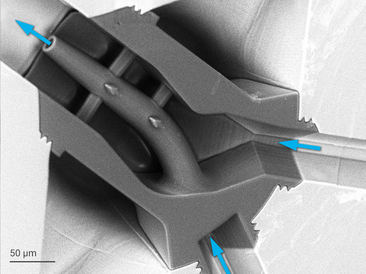 Embedded spinneret directly 3D-printed into a microfluidic channel system. The nozzle has a tip of 12 µm diameter.